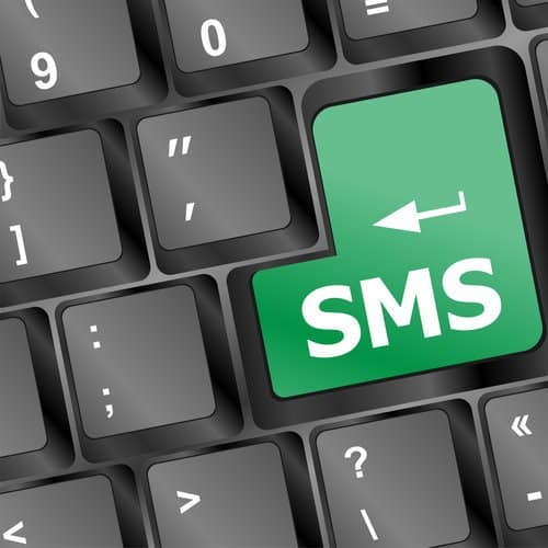 Social media key with SMS text on laptop keyboard
