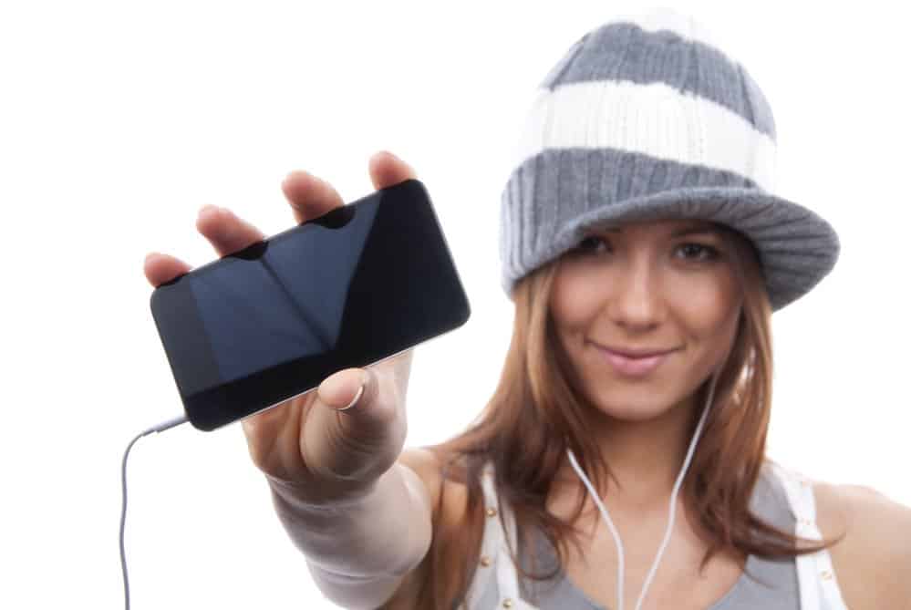Woman Showing display of her new touch mobile cell phone