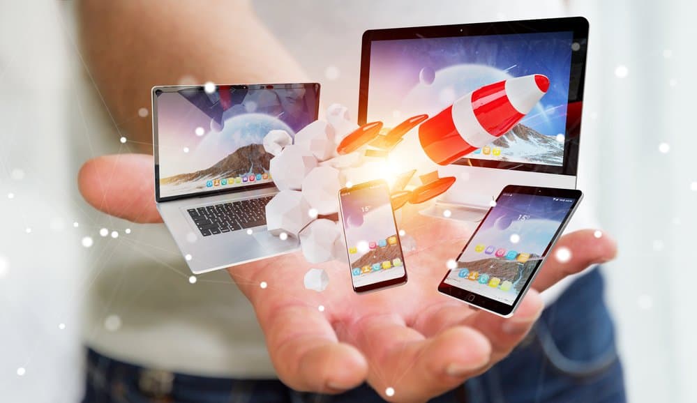 Businessman connecting tech devices and startup rocket 3D render