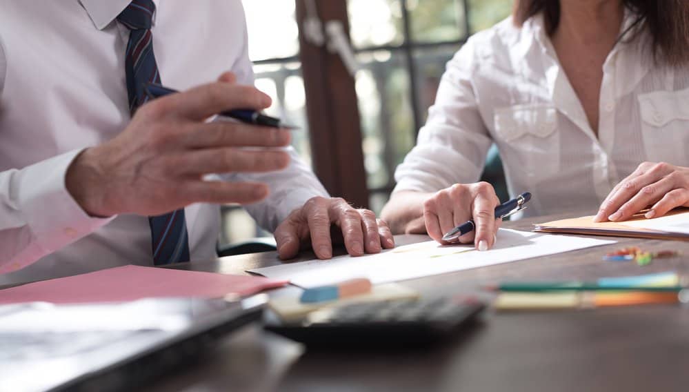 Senior manager working with executive assistant